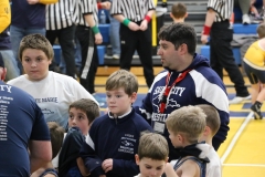 Coach-Matt-Ball-and-wrestlers-warming-up