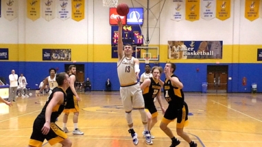 Justin Fischer puts up a floater in first half action Saturday against MI Tech.