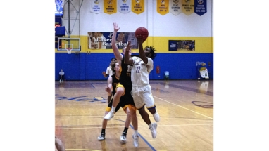 Nigel Colvin goes strong to the basket in first half action Saturday against MI Tech.