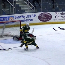 BRANDON PURICELLI HAS A CHANCE TO SCORE IN HOCKEY ACTION AGAINST NMU SUNDAY AFTERNOON.