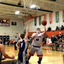E.J. SUGGITT DRIVES THE LANE IN FIRST QUARTER ACTION AGAINST RUDYARD FRIDAY EVENING.