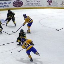 JACK JEFFERS ATTEMPTS A SHOT IN HOCKEY ACTION AGAINST NMU SUNDAY AFTERNOON.