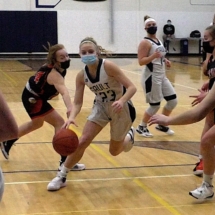 Jordyn Haller drives into the lane in first quarter action Thursday evening against Escanaba.