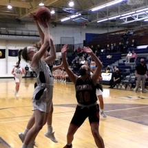 Mackenzie Bell's shot is blocked in first quarter action Thursday evening against Escanaba