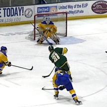 NMU'S BRANDON SCHULTZ TAKES A SHOT IN SUNDAY'S ACTION AGAINST LSSU. GOALIE ETHAN LANGENEGGER MADE THE STOP.