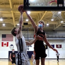 BENNETTE SWANSON'S SHOT IS BLOCKED BY 6'7_ COLIN HUDSON N FRIDAY NIGHT ACTION.