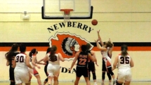 Bailey Zellar makes the first basket of the game in District Final Action in Newberry.