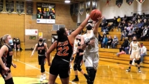 Brooklyn Besteman blocks a lay up attempt by Tabby Shepard in frist quarter action. Rudyard upset the Saints Friday night with a score of 51-47.