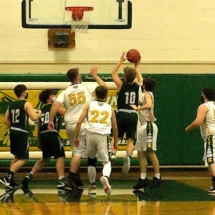 Caleb Kohlmann grabs a rebound and puts it back in for the basket in Engadine Friday night.