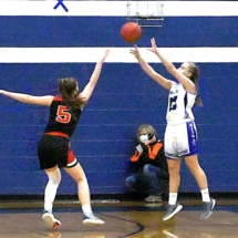 ELIZABETH JOHNSON FIRES IN THE THREE AS BAILEY ZELLAR TRIES TO DEFEND THE SHOT IN FRIDAY NIGHT ACTION IN BRIMLEY.