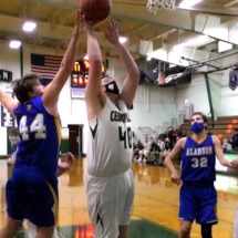 ETHAN BIGELOW PUTS IN THE SHOT FROM UNDER THE BASKET IN THURSDAY EVENING ACTION AGAINST THE ALANSON VIKINGS.