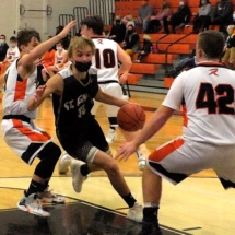 Ethan McLean drives in the paint in Monday evening action in Rudyard.