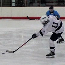 GEORGE BAUMAN TAKES A SHOT IN FRIDAY NIGHT ACTION AGAINST PETOSKEY.