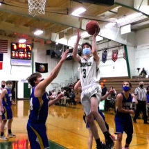 HOSSACK SWEENEY PUTS IN THE LAY UP IN THURSDAY EVENING ACTION AGAINST THE ALANSON VIKINGS.