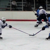 JOEY ENGLE BREAKS UP A SHOT IN FRIDAY NIGHT ACTION AGAINST PETOSKEY.