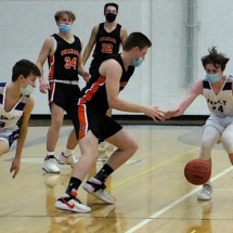 JONAH MCSHANE STEALS THE BALL AWAY FROM AN ESCANABA PLAYER IN FRIDAY NIGHT.