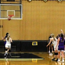 Kennedy Guild fires in another three in basketball action St. Ignace Tuesday Night.