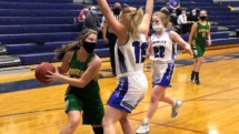 Kora Blake plays some good defense against Leah French in first quarter action Thursday evening.