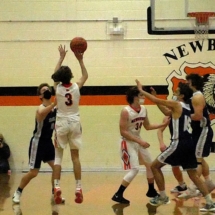 Logan Depew goes up for three in Friday night action in Newberry.