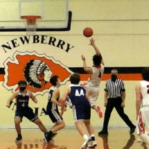 Marco Juarez goes up for two in Friday night action in Newberry.