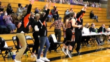 Rudyard bench cheers after the final buzzer sounds. Rudyard upset the Saints Friday night with a score of 51-47.