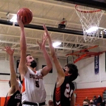 TATE BESTEMAN WORKS HARD IN THE PAINT FOR A BASKET IN SECOND QUARTER ACTION AGAINST CHEBOYGAN.