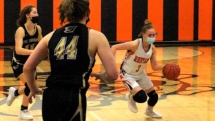 Tristin Smith starts to drive into the lane in Wednesday action in Rudyard.