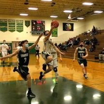 Wyatt Flatt drives in the for the lay up in first quarter action in Engadine Friday night.