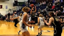 Ally Schultz launches a three late in the game against Calumet in the Soo High Gym Wednesday evening. Saints lost in overtime 65-55 in the Regional Final game.