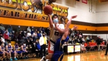 Austin Warner goes for for a layup for Rudyard in Thursday night Regional action against Alanson in Pellston.
