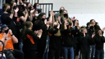 Rudyard Student Section cheers the final score against Carney Nadeau Wednesday at the Soo High Gym.